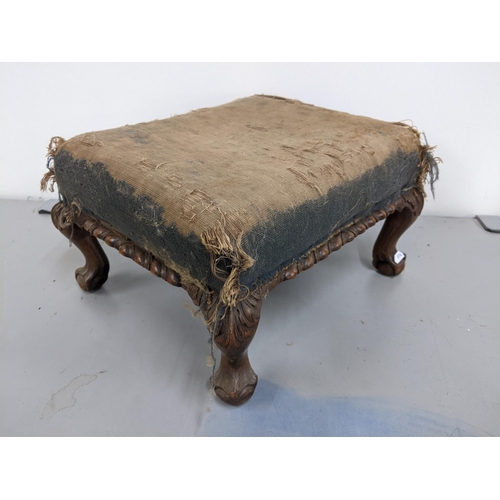 171 - An early 20th century mahogany small footstool raised on claw and ball feet
Location: A1F