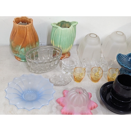 173 - A mixed lot to include glass lamp shades, one pink example, ceramic vases and other mixed glassware ... 