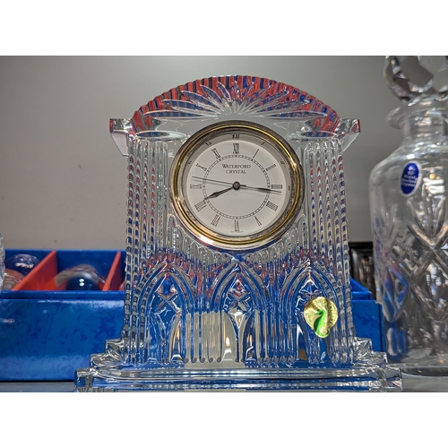 179 - Mixed glass to include a Waterford Crystal mantel clock, Stuart Crystal, boxed glass and a glass glo... 