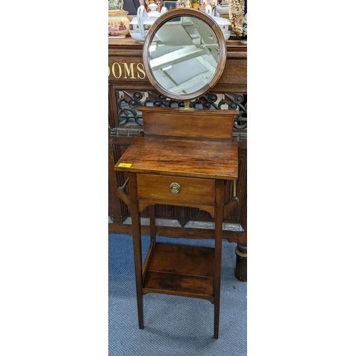 185 - An early 20th century mahogany shaving stand with a mirror over a drawer
Location: BWR