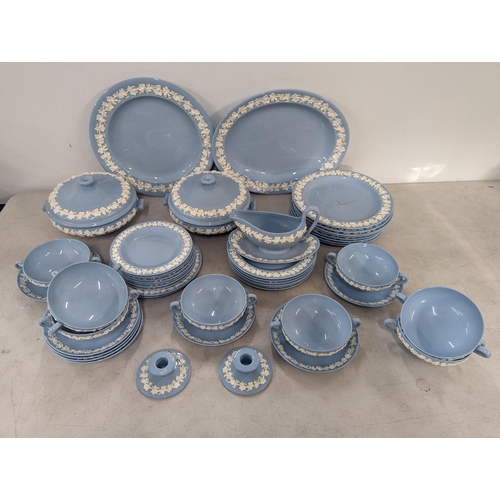 191 - A Wedgwood embossed Queens ware part dinner service to include twin handled bowls, tureens, sauce bo... 