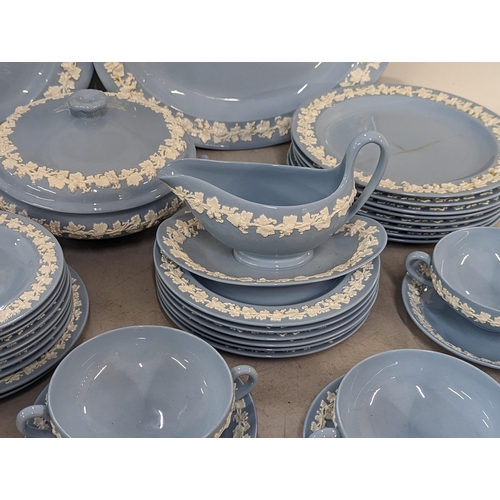 191 - A Wedgwood embossed Queens ware part dinner service to include twin handled bowls, tureens, sauce bo... 