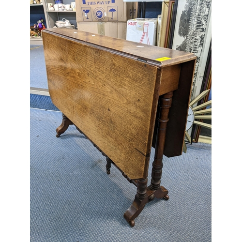 198 - A late Victorian walnut octagonal topped Sutherland table having turned legs and a central support 6... 