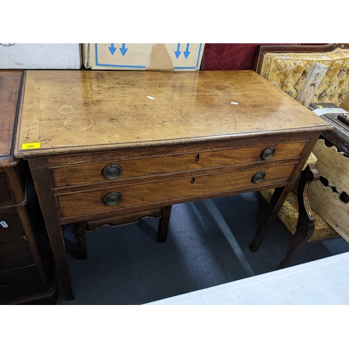 204 - An early 19th century mahogany side table having two drawers and on squared tapering legs, 74cm x 96... 