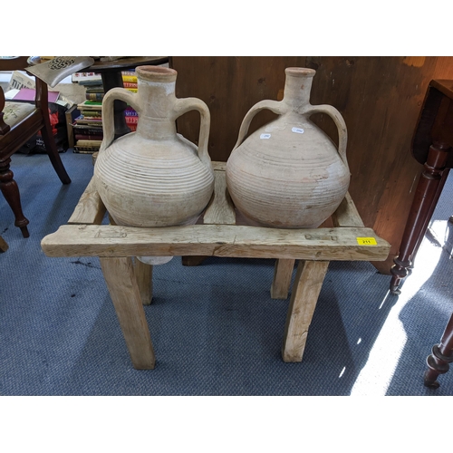 211 - Two French olive pots in a stand on block shaped legs
Location: BWR
proceeds to Chengelo Edicational... 