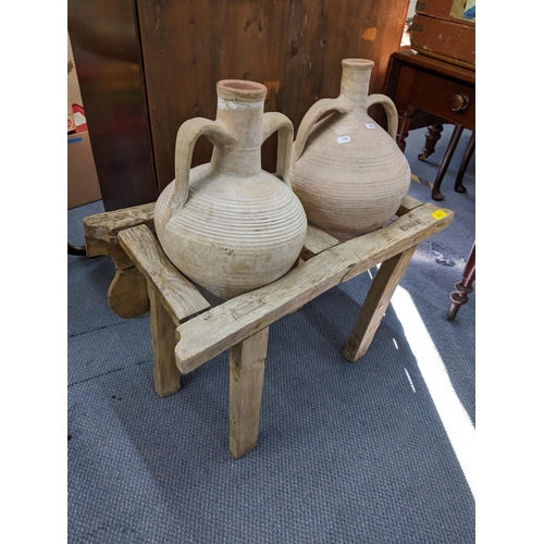 211 - Two French olive pots in a stand on block shaped legs
Location: BWR
proceeds to Chengelo Edicational... 