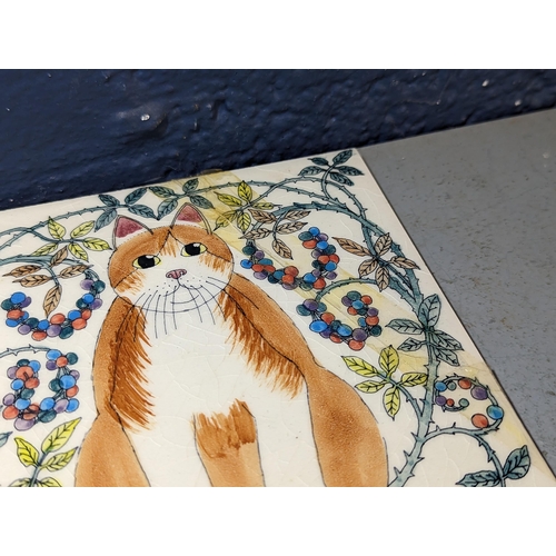 223 - A collection of mixed ceramics to include a blue and white model of a cat a/f, a large Poole pottery... 