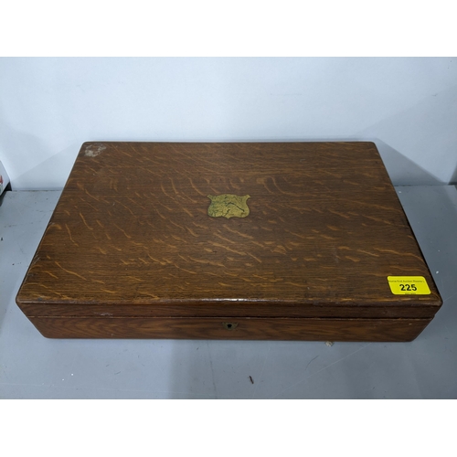 225 - An early 20th century oak box inlaid with a brass plaque to the top
Location: 1.4