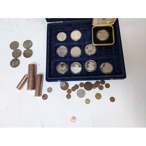 229 - Coins to include uncirculated 2p, 1p and 1/2p, two silver coins and others along with Snickers badge... 