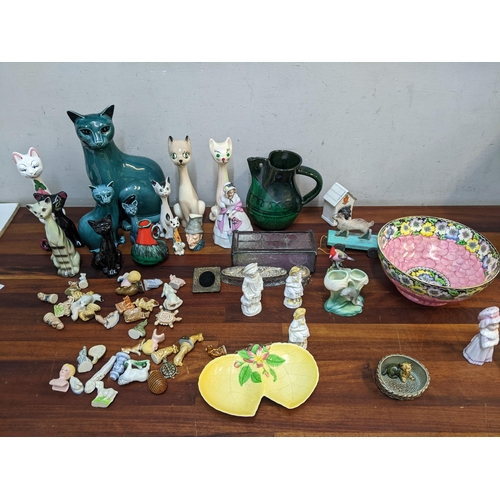 232 - Ceramics, silver plate and other items to include Poole pottery casts, a Shelley crested china model... 