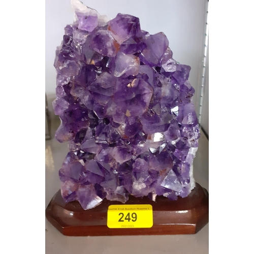 249 - A large amethyst cluster specimen mounted on a treen base
Location: 11.1
proceeds to Chengelo Edicat... 