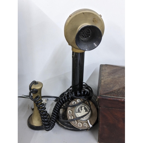 287 - An early 19th century mahogany tea caddy together with a 'Conversation Pieces' candlestick telephone... 