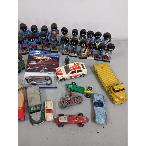 293 - A mixed lot to include Golly football and band figures, signed Rugby ball and toy cars to include Co... 