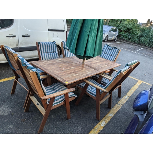 298 - A nelson New Zealand teak garden table, 72cm h x 200cm w x 97cm d together with seven chairs and a p... 