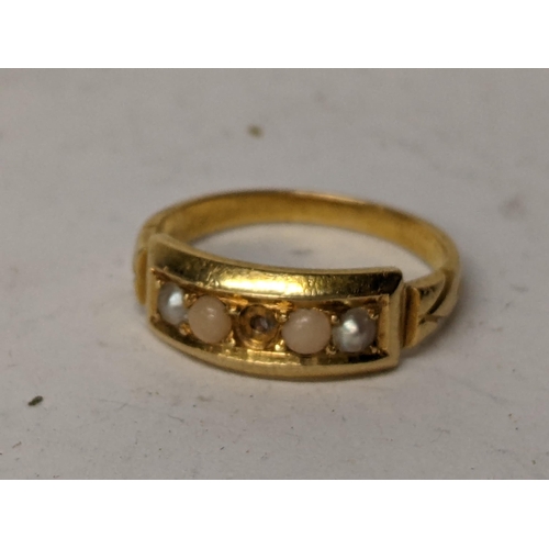59 - A yellow metal ring inset with seed peals, central stone missing. 3.8g
Location: RING