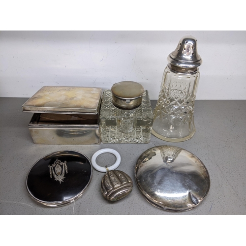 70 - Mixed silver to include a cigarette box A/F, rattle, silver topped inkwell, dressing table jar lids ... 