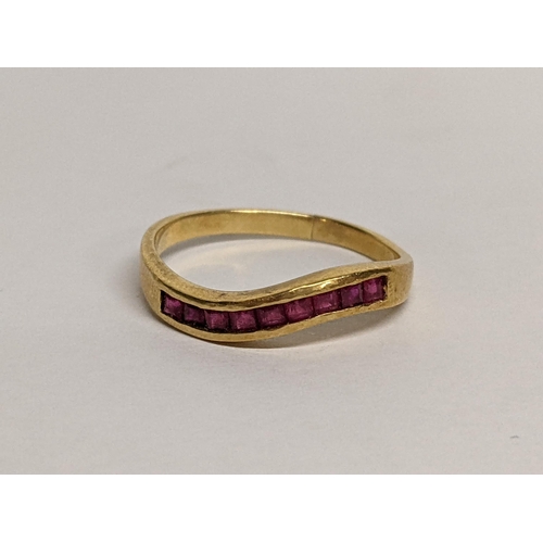 76 - An 18ct ring inset with nine rubies, 2.7g
Location: RING