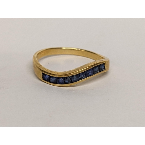 77 - An 18ct ring inset with nine sapphires, 2.5g
Location: RING