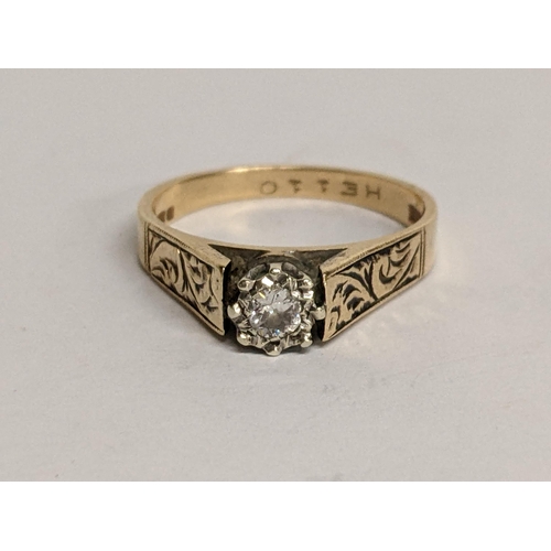 80 - A 9ct gold diamond ring in a claw setting and engraved shoulders, 3.2g
Location: RING