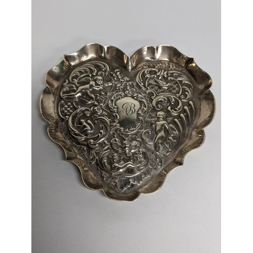 87 - A silver cherub decorated pin dish, 50.1g
Location: TABLE