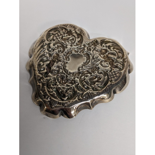 87 - A silver cherub decorated pin dish, 50.1g
Location: TABLE