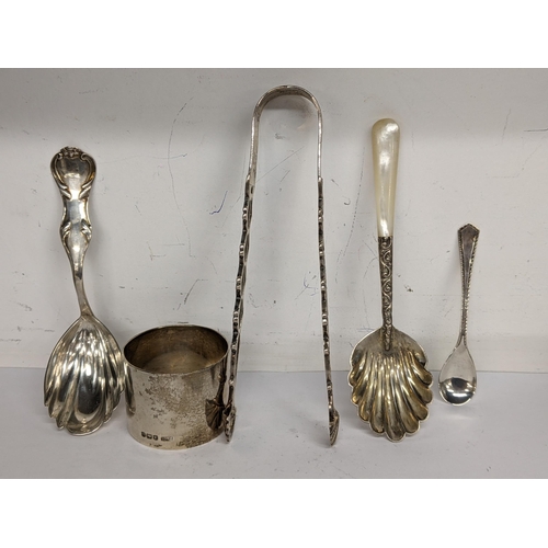 95 - Mixed silver to include a napkin ring, sugar tongs and three spoons, total weight 117.1g
Location: T... 