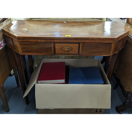 200 - A late Georgian mahogany and boxwood octagonal topped fold over tea table, 74cm h x 95.5cm w
Locatio... 