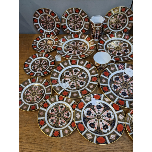 411 - Royal Crown Derby Imari pattern china to include 15 plates and another copy, together with a cup and... 