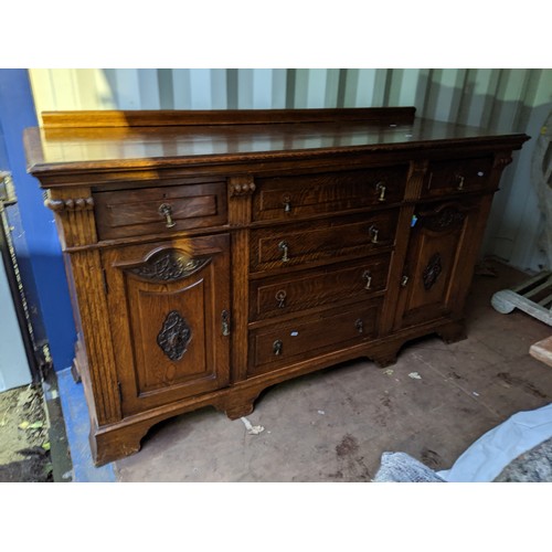 435 - An early 20th century oak sideboard having a raised back and two cupboard doors
Location: CON