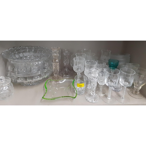 164 - A quantity of mixed domestic glass to include glass candlesticks and airtwist pedestal glasses, and ... 