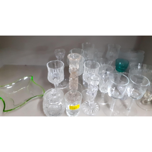 164 - A quantity of mixed domestic glass to include glass candlesticks and airtwist pedestal glasses, and ... 