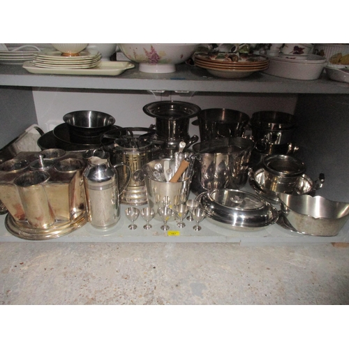 167 - A large selection of silver plated wares to include plates, cutlery, wine cooler, tureens, trays and... 