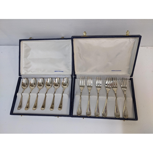 244 - A set of six Italian silver forks and spoons stamped 800, cased, 221g Location: 7.4