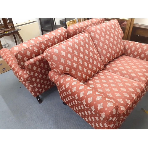 312 - Two two seater sofas in red with white floral sprays, in two sizes, 122cm w and 147cm w
Location: RA... 