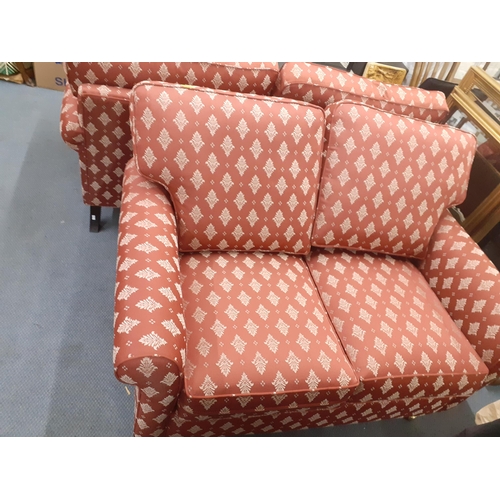 312 - Two two seater sofas in red with white floral sprays, in two sizes, 122cm w and 147cm w
Location: RA... 