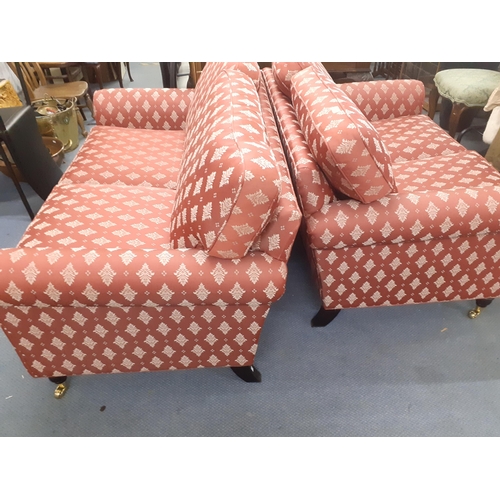 312 - Two two seater sofas in red with white floral sprays, in two sizes, 122cm w and 147cm w
Location: RA... 