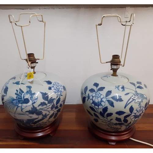 320 - A pair of blue and white Oriental vases on red wooden stands, 20cm high
Location: G