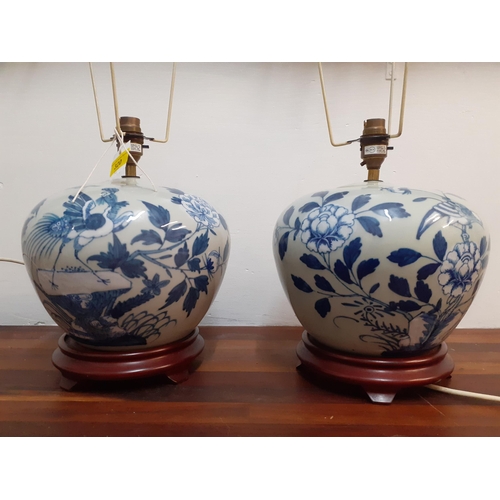 320 - A pair of blue and white Oriental vases on red wooden stands, 20cm high
Location: G