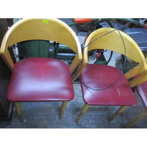 345 - A set of four beech framed chairs with curved backs and splayed legs
Location:G