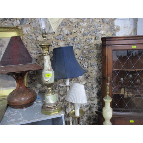 346 - A group of standard lamps and table lamps to include a white painted wrought iron tripod standard la... 