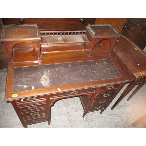 353 - Victorian mahogany kneehole writing desk, the top with mirrored back, below a galleried shelf flanke... 