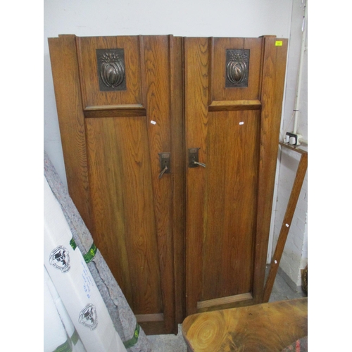 355 - An Arts & Crafts oak wardrobe with twin doors with inset copper plaques, copper handles and escutche... 