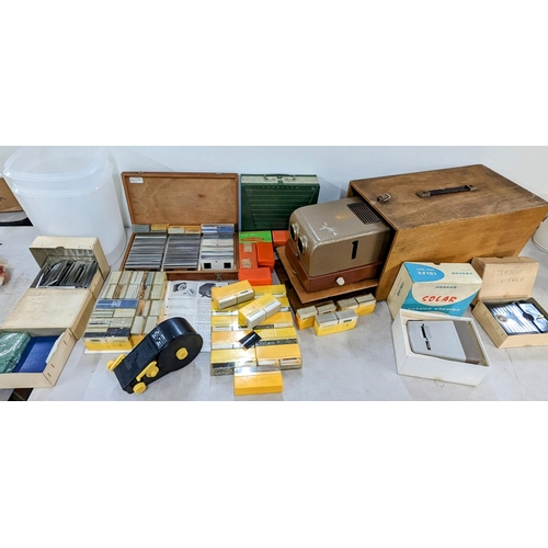 334 - A mixed lot to include a vintage projector, The Hawk Mk V in case, along with mixed frames, slides, ... 