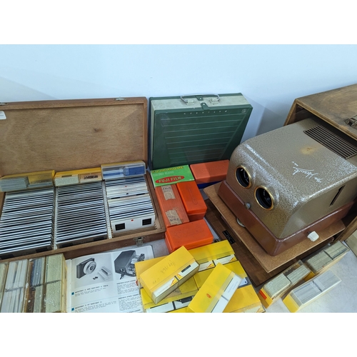 334 - A mixed lot to include a vintage projector, The Hawk Mk V in case, along with mixed frames, slides, ... 