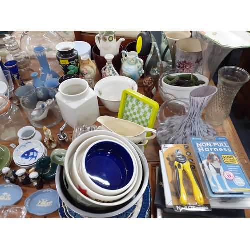 412 - A large mixed household lot to include Wedgwood blue Jasperware, a blue Denby teapot, glassware to i... 