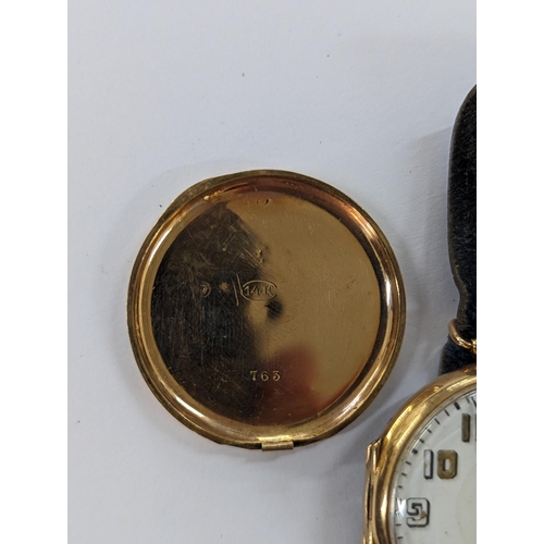 423 - An early 20th century trench watch A/F stamped 14K having a white enamel dial inscribed Alex Ross & ... 