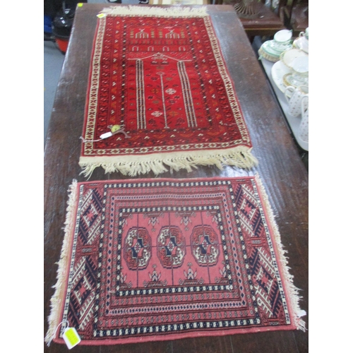 438 - Two Middle Eastern hand woven rugs.Location: TABLE