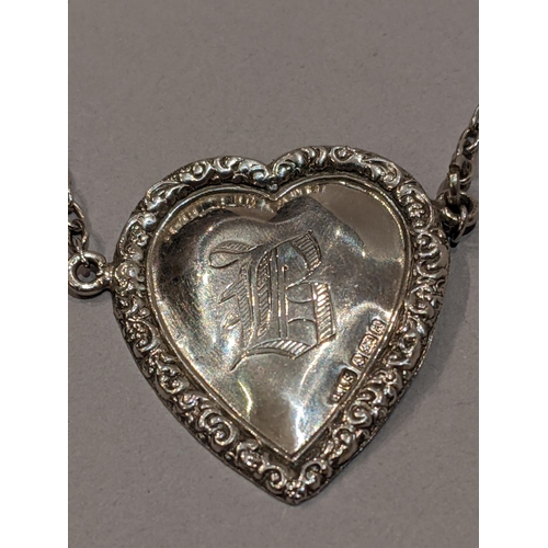 59 - A silver heart shaped decanter label for Brandy or Bourbon, inscribed B by Levi and Salaman, Birming... 