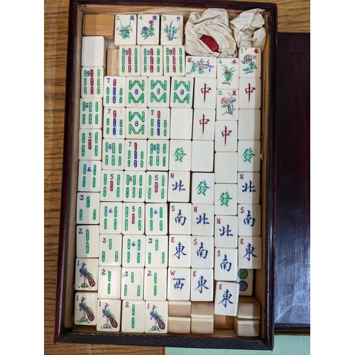 63 - A Mahjong set with counters in a wood case
Location: RWM