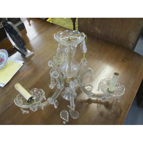 204 - A gilt metal and cut glass three branch ceiling chandelier
Location: G